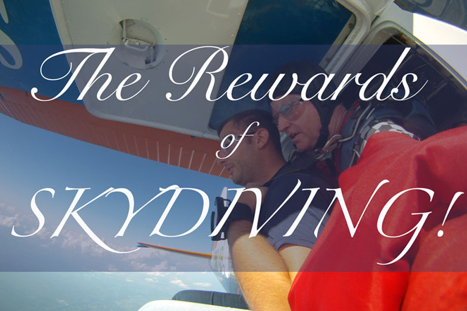 Tandem instructor and student kneel in the door of a Cessna-182 while preparing to exit with the text The Rewards of Skydiving!